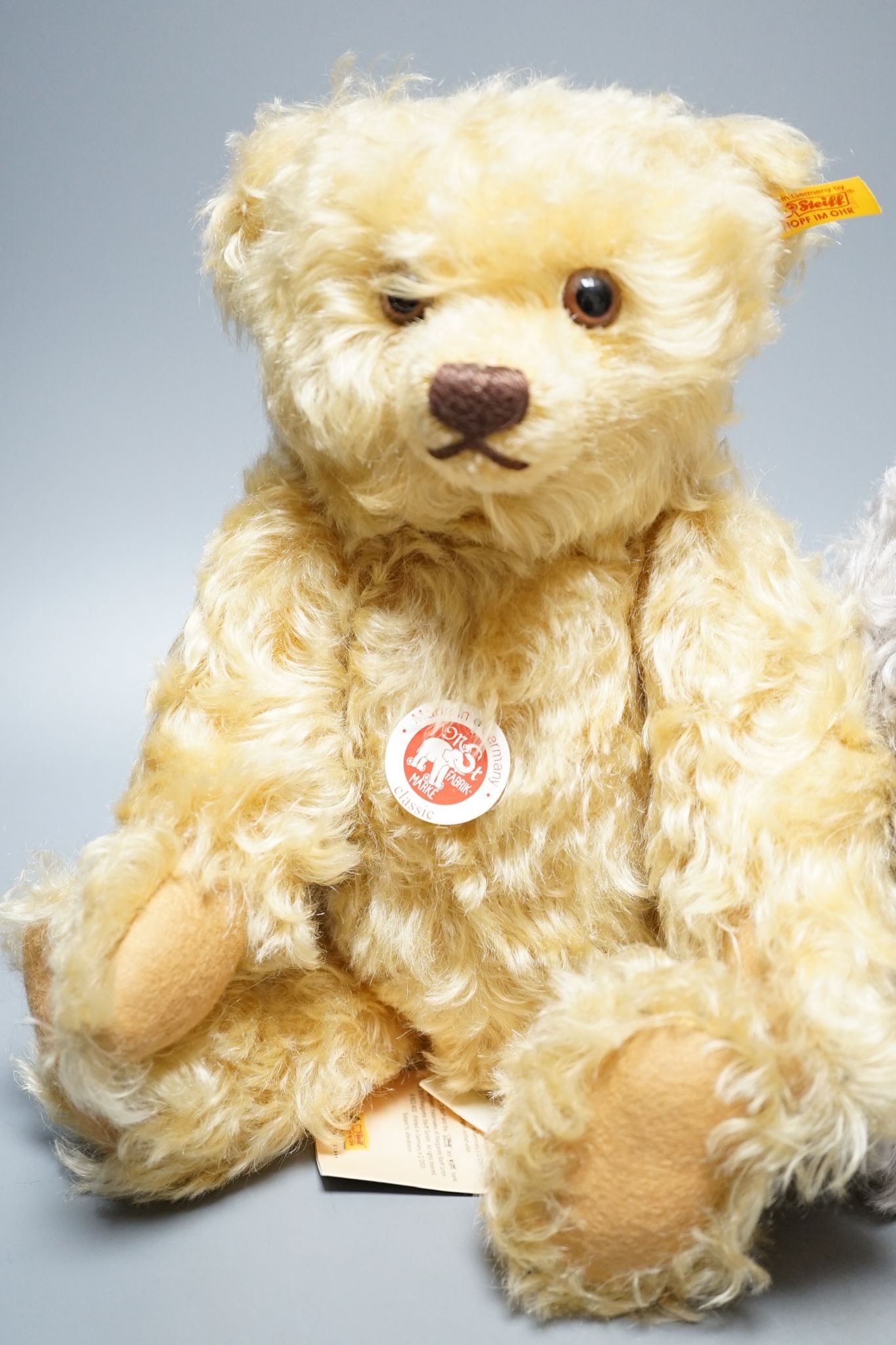 A Steiff Yellow tag Classix boxed Gold Bear, 34cmm with Steiff Yellow tag Grey, 34cm, box, also a Black Steiff Classic Yellow tag, box, 32cm